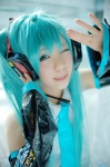 aqua_hair cosplay default_costume detached_sleeves hatsune_miku headset kousaka_yun tie twintails vocaloid rating:Safe score:2 user:nil!