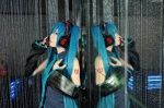 blouse blue_hair cosplay detached_sleeves haruka hatsune_miku headset mirror sleeveless_blouse twintails vocaloid rating:Safe score:0 user:nil!