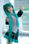 aqua_hair beng cosplay default_costume detached_sleeves hatsune_miku headset pleated_skirt skirt tie twintails vocaloid rating:Safe score:1 user:nil!