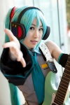 aqua_hair cosplay detached_sleeves guitar hatsune_miku headset tie twintails vocaloid yuki_nano rating:Safe score:0 user:pixymisa