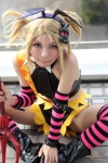 blonde_hair boots collar cosplay croptop detached_sleeves head_wings kagamine_len michiko pitchfork pretty_panties_akuma_rin_(vocaloid) shorts spikes striped thighhighs vocaloid rating:Safe score:2 user:pixymisa