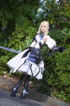 ageha blonde_hair boots breastplate cosplay detached_sleeves dress fate/series fate/unlimited_codes gauntlets hairbow pantyhose saber_lily sword white_legwear rating:Safe score:0 user:nil!