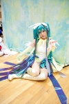 aqua_hair boots cosplay detached_sleeves dress hatsune_miku headdress jiruko twintails vocaloid rating:Safe score:2 user:pixymisa