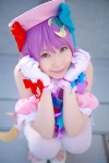 amatsuka_miyu bows bowtie cosplay dress gloves hairbows hat patchouli_knowledge purple_eyes purple_hair thighhighs touhou twintails zettai_ryouiki rating:Safe score:1 user:pixymisa