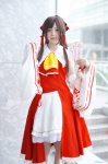 blouse cosplay detached_sleeves hairbow hakurei_reimu hino_(ii) miko miniskirt skirt touhou rating:Safe score:1 user:nil!