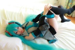 aqua_hair arai_yomi bed blouse cosplay detached_sleeves hatsune_miku headset panties pleated_skirt skirt thighhighs tie twintails vocaloid rating:Safe score:3 user:nil!