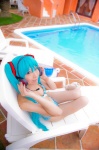 aqua_hair bikini cleavage cosplay hatsune_miku headset mashiro_yuki pool project_diva swimsuit twintails vocaloid rating:Safe score:1 user:nil!