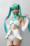 aqua_hair bikini cosplay detached_sleeves hatsune_miku necoco skirt swimsuit thighhighs twintails vocaloid rating:Safe score:1 user:pixymisa