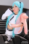 aqua_hair cosplay detached_sleeves hair_ribbons hatsune_miku microphone miniskirt nei project_diva skirt thighhighs twintails vocaloid rating:Safe score:0 user:pixymisa