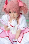 amemiya_luna bows choker cosplay dress gloves hair_ribbons kaname_madoka pink_hair puella_magi_madoka_magica twintails rating:Safe score:0 user:pixymisa