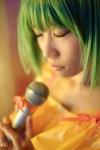 cosplay green_hair macross macross_frontier microphone mikan ranka_lee tank_top rating:Safe score:0 user:nil!
