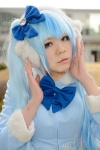 blouse blue_hair bow cosplay ear_muffs hairbow hatsune_miku mikan_(ii) twintails vocaloid rating:Safe score:0 user:pixymisa