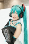 aqua_hair blouse blue_eyes chica cosplay detached_sleeves hatsune_miku headset twintails vocaloid rating:Safe score:0 user:pixymisa