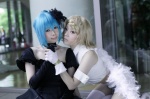 aqua_hair blonde_hair chains choker cosplay elbow_gloves fingerless_gloves gloves gown hatsune_miku himitsu_~kuro_no_chikai~_(vocaloid) kagamine_rin kana_(ii) shorts sleeveless_blouse thighhighs vocaloid wings yuyu_kaname rating:Safe score:0 user:nil!