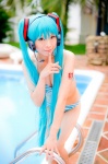 aqua_hair bikini cleavage cosplay hatsune_miku headset mashiro_yuki pool project_diva swimsuit twintails vocaloid rating:Safe score:1 user:nil!