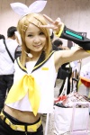 blonde_hair cosplay default_costume detached_sleeves hairbow hair_clips headset hiromichi kagamine_rin sailor_uniform school_uniform shorts vocaloid rating:Safe score:1 user:nil!