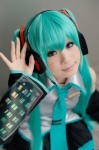 aqua_hair cosplay default_costume detached_sleeves hatsune_miku headset pleated_skirt skirt thighhighs tie twintails vocaloid rating:Safe score:0 user:nil!
