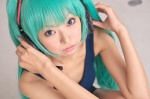 aqua_hair cosplay hatsune_miku headset necoco necosmo one-piece_swimsuit swimsuit twintails vocaloid rating:Safe score:0 user:nil!