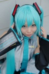 aqua_hair cosplay default_costume detached_sleeves hatsune_miku headphones microphone mizuhara_aiko pleated_skirt skirt thighhighs tie twintails vocaloid rating:Safe score:0 user:nil!