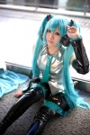 aqua_hair boots cosplay default_costume detached_sleeves hatsune_miku headset pleated_skirt skirt thigh_boots thighhighs tie twintails uriu vocaloid zettai_ryouiki rating:Safe score:0 user:nil!