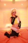 bed blonde_hair boots cosplay detached_sleeves hairbow headphones kagamine_rin panties shorts tanaka_mana vocaloid rating:Questionable score:0 user:shiwahentai