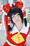 blouse cosplay detached_sleeves ema hairbow hakurei_reimu miko skirt touhou rating:Safe score:1 user:nil!