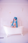 aqua_hair bathroom bathtub bikini cleavage cosplay hatsune_miku headset mashiro_yuki project_diva swimsuit twintails vocaloid rating:Safe score:0 user:nil!