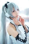 cosplay detached_sleeves halter_top hatsune_miku headset shuuto silver_hair twintails vocaloid voice_(vocaloid) rating:Safe score:0 user:pixymisa