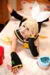bed blonde_hair cosplay default_costume detached_sleeves hairbows hair_clips headset kagamine_rin legwarmers ryuga sailor_uniform school_uniform shorts vocaloid rating:Safe score:2 user:nil!