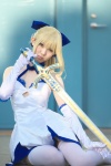 blonde_hair blue_eyes cosplay dress elbow_gloves fate/series fate/stay_night gloves hairbow rinami saber slip sword thighhighs rating:Safe score:4 user:pixymisa