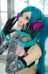 aqua_hair cosplay croptop detached_sleeves hatsune_miku headset inumachi_yuzu project_diva shorts twintails vocaloid rating:Safe score:0 user:nil!