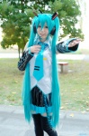 aice aqua_hair cosplay default_costume detached_sleeves hatsune_miku headset pleated_skirt skirt thighhighs tie twintails vocaloid zettai_ryouiki rating:Safe score:0 user:nil!