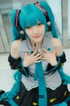 aqua_hair blouse cosplay detached_sleeves hatsune_miku headset kuuya pleated_skirt skirt thighhighs tie twintails vocaloid rating:Safe score:1 user:nil!