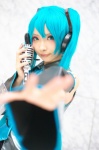 aqua_hair blouse cosplay detached_sleeves hatsune_miku headset microphone mineo_kana pleated_skirt skirt tie twintails vocaloid rating:Safe score:1 user:pixymisa