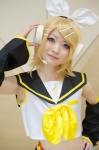 blonde_hair cosplay detached_sleeves hairbow hair_clips headset kagamine_rin nepachi sailor_uniform school_uniform shorts vocaloid rating:Safe score:0 user:nil!