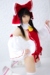 bodysuit boots cosplay detached_sleeves hairbow hakurei_reimu kneepads lenfried miko thighhighs touhou rating:Safe score:0 user:nil!