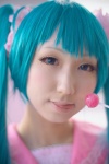 aqua_eyes aqua_hair cosplay dress hatsune_miku lollipop seri twintails vocaloid rating:Safe score:0 user:pixymisa