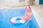 bikini_top cleavage cosplay hair_ribbons inner_tube kaname_madoka mashiro_yuki miniskirt pink_hair pool puella_magi_madoka_magica skirt swimsuit twintails wet rating:Safe score:0 user:nil!