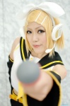 blonde_hair cosplay default_costume detached_sleeves hairbow headset kagamine_rin microphone shorts vocaloid yuuhi rating:Safe score:0 user:nil!