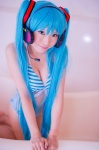 aqua_hair bathroom bathtub bikini cleavage cosplay hatsune_miku headset mashiro_yuki project_diva swimsuit twintails vocaloid rating:Safe score:1 user:nil!