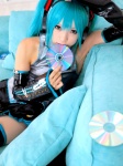 aqua_hair blouse cosplay detached_sleeves hatsune_miku headset kipi pleated_skirt skirt thighhighs tie twintails vocaloid zettai_ryouiki rating:Safe score:6 user:nil!