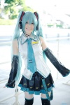 aqua_hair blouse cosplay detached_sleeves hatsune_miku headset pleated_skirt popuri skirt thighhighs tie twintails vocaloid zettai_ryouiki rating:Safe score:0 user:nil!