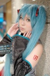 aqua_hair ayata blouse cosplay detached_sleeves hatsune_miku headset tie twintails vocaloid rating:Safe score:0 user:nil!