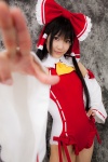cosplay detached_sleeves hairbow hakurei_reimu lenfried miko one-piece_swimsuit swimsuit touhou rating:Safe score:0 user:nil!