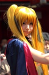 bardiche blonde_hair bodysuit cape cosplay enako fate_testarossa lyrical_nanoha twintails rating:Safe score:1 user:nil!