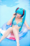aqua_hair bikini cleavage cosplay hatsune_miku headset inner_tube mashiro_yuki pool project_diva swimsuit twintails vocaloid wet rating:Safe score:0 user:nil!