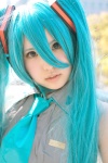 aqua_hair cosplay default_costume detached_sleeves hatsune_miku headset sajou_erio tie twintails vocaloid rating:Safe score:0 user:nil!