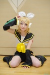 blonde_hair cosplay detached_sleeves hairbow hair_clips headset kagamine_rin leggings nepachi sailor_uniform school_uniform shorts vocaloid rating:Safe score:0 user:nil!
