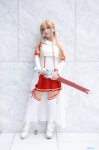 asuna_(sao) blonde_hair blouse boots breastplate cosplay detached_sleeves pleated_skirt skirt sword sword_art_online ten thighhighs zettai_ryouiki rating:Questionable score:0 user:nil!
