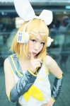 blonde_hair blouse blue_eyes cosplay detached_sleeves hairbow headset kagamine_rin satou_shio scarf_tie shorts vocaloid rating:Safe score:0 user:pixymisa